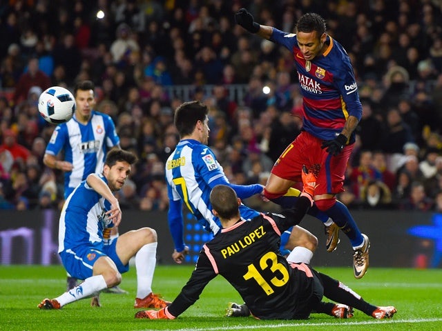 Barcelona's Neymar competes for the ball with Espanyol players during the Copa del Rey round-of-16 first leg at Camp Nou on January 6, 2016