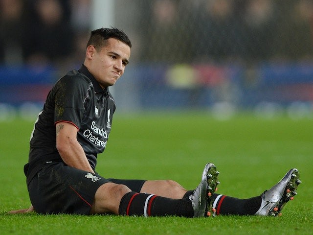 Philippe Coutinho sits injured during the League Cup semi-final between Stoke and Liverpool on January 5, 2016