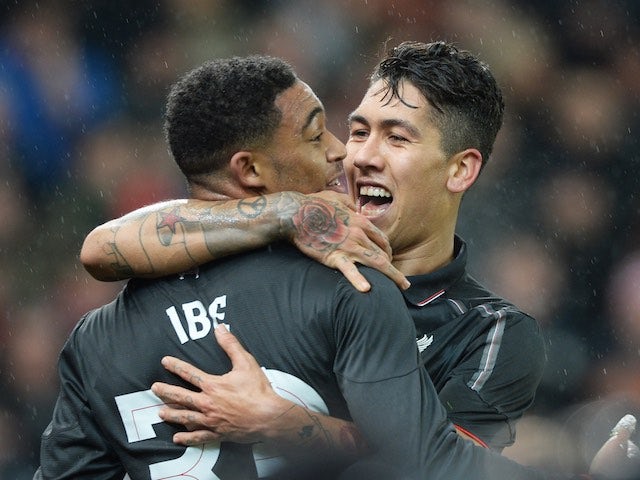 Roberto Firmino congratulates Jordon Ibe after he scores during the League Cup semi-final between Stoke and Liverpool on January 5, 2016