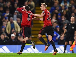 Craig Gardner of West Bromwich Albion celebrates scoring his team's first goal with his teammate Darren Fletcher against Chelsea at Stamford Bridge on January 13, 2016