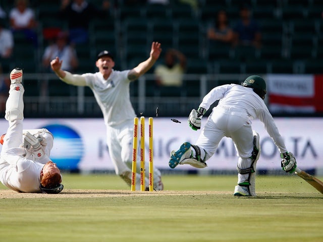 Jonny Bairstow of England runs out Temba Bavuma of South Africa from Chris Woakes's fielding off Stuart Broad of England's bowling on January 14, 2016