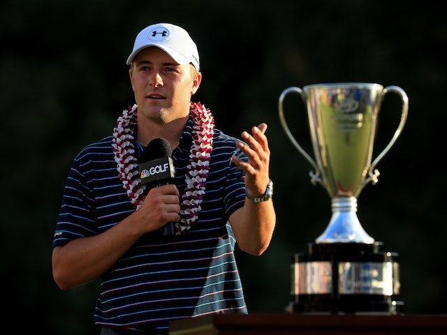 Jordan Spieth poses with his trophy at the Hyundai Tournament of Champions on January 10, 2016