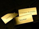Gold placards bearing the names of FIFA Ballon d'Or nominees Lionel Messi, Cristiano Ronaldo and Neymar