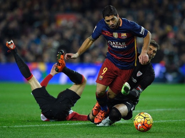 Luis Suarez is hacked down by Gorka Iraizoz during the game between Barcelona and Athletic Bilbao on January 17, 2016
