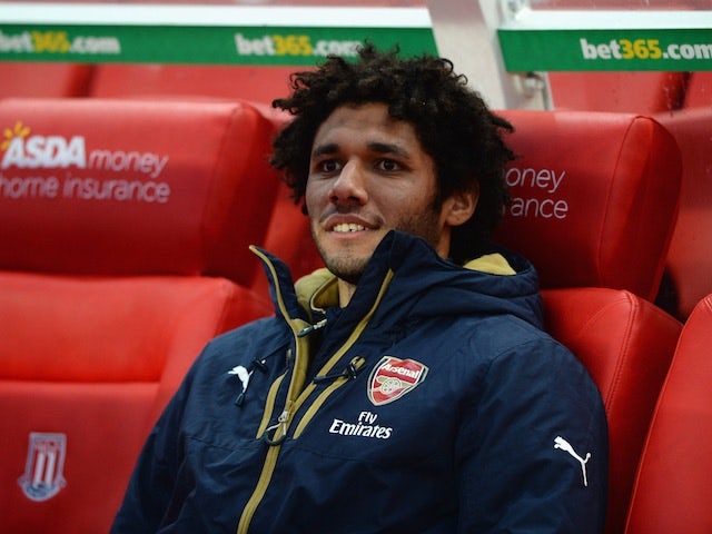 Arsenal substitute Mohamed Elneny watches on at the Britannia Stadium on January 17, 2016