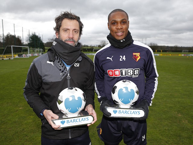Quique Sanchez Flores and Odion Ighalo with their Manager and Player of the Month awards for December 2015