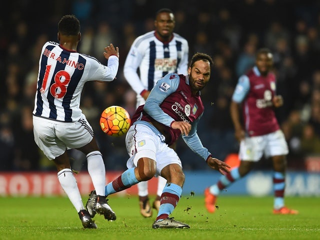Joleon Lescott of Aston Villa and Saido Berahino of West Bromwich Albion compete for the ball on January 23, 2016
