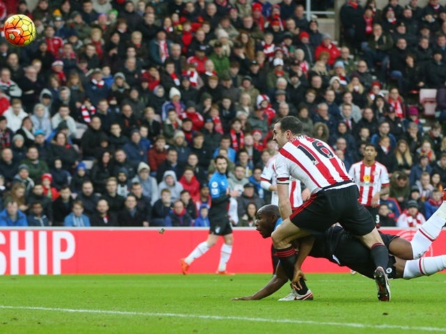 Benik Afobe of Bournemouth heads the ball to score his team's first goal against Sunderland on January 23, 2016