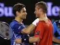 David Ferrer and Lleyton Hewitt meet at the net following their second-round match and Hewitt's final match during day four of the 2016 Australian Open on January 21, 2016 