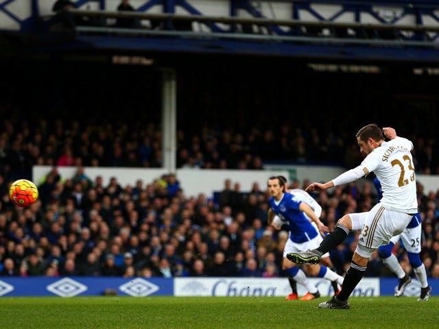 Gylfi Sigurdsson of Swansea City scores the opening goal from the penalty spot against Everton on January 24, 2016