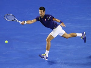 Djokovic toils to quarter-final berth