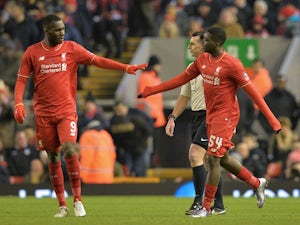 Oluwaseyi Ojo is congratulated by Christian Benteke after he scores Liverpool's second goal against Exeter City at Anfield on January 20, 2016