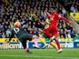 Roberto Firmino scores Liverpool's third goal during the Premier League match against Norwich City on January 23, 2016