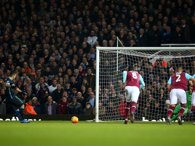 Sergio Aguero of Manchester City converts the penalty to score his team's first goal against West Ham United and Manchester City at the Boleyn Ground on January 23, 2016