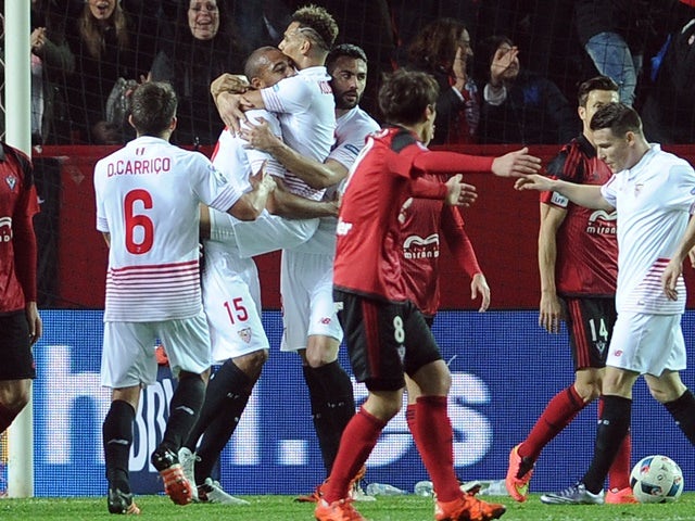 Sevilla players celebrate a goal against Mirandes at the Ramon Sanchez Pizjuan stadium in Sevilla on January 21, 2016