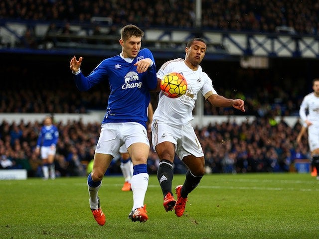 Wayne Routledge and big John Stones in action during the game between Everton and Swansea on January 24, 2016