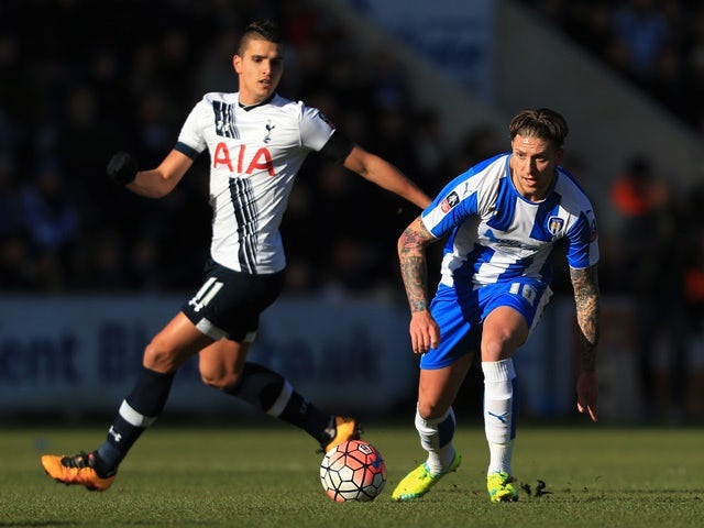 George Moncur of Colchester United and Erik Lamela of Tottenham Hotspur compete for the ball on January 30, 2016