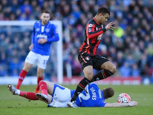 Joshua King of Bournemouth and Ben Davies of Portsmouth compete for the ball on January 30, 2016
