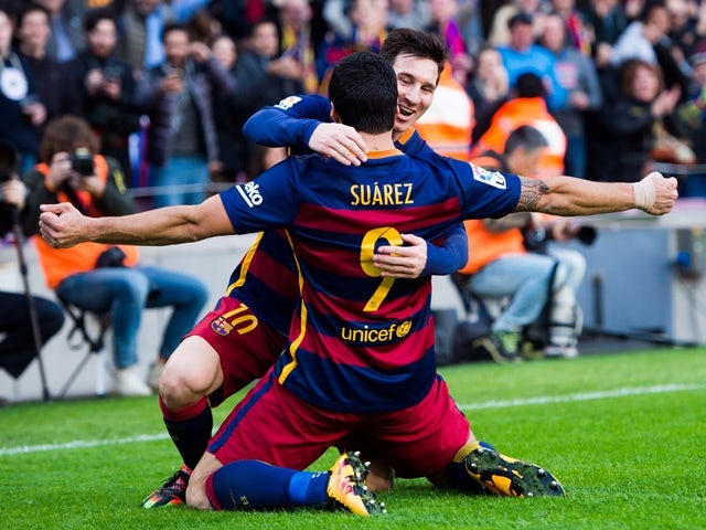  Luis Suarez celebrates with Lionel Messi after scoring his team's second goal during the La Liga match between FC Barcelona and Club Atletico de Madrid at Camp Nou on January 30