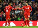 Adam Lallana celebrates scoring with Roberto Firmino during the Premier League game between Liverpool and Sunderland on February 6, 2016