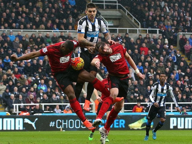 Aleksandar Mitrovic rises highest above Victor Anichebe and Jonas Olsson during the Premier League game between Newcastle United and West Bromwich Albion on February 6, 2016