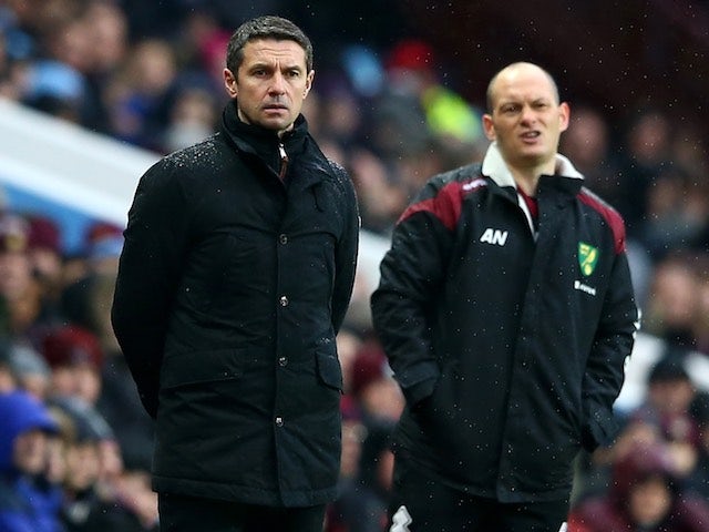 Alex Neil and Remi Garde watch on during the Premier League game between Aston Villa and Norwich City on February 6, 2016