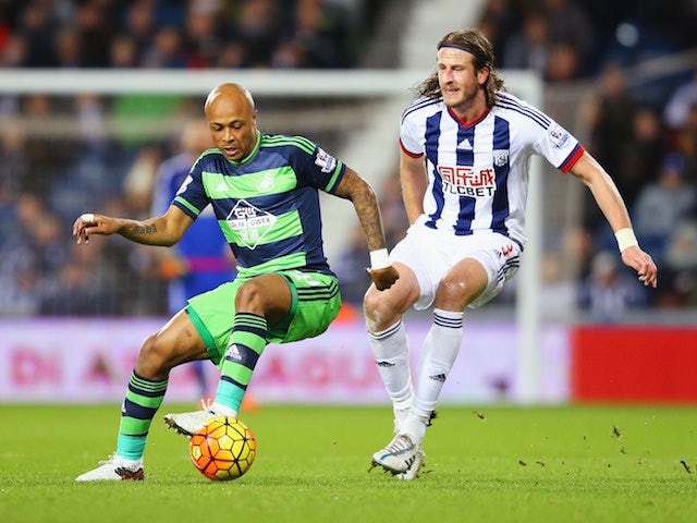 Andre Ayew and Jonas Olsson in action during the Premier League game between West Brom and Swansea on February 2, 2016