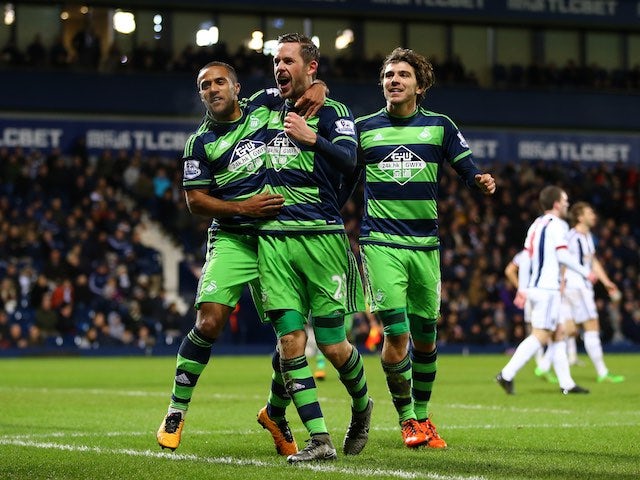 Gylfi Sigurdsson celebrates scoring during the Premier League game between West Brom and Swansea on February 2, 2016