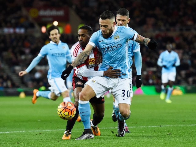 Jermain Defoe tenderly grabs Nicolas Otamendi during the Premier League game between Sunderland and Manchester City on February 2, 2016
