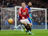 Wayne Rooney and Cesc Fabregas in action during the Premier League game between Chelsea and Manchester United on February 7, 2016