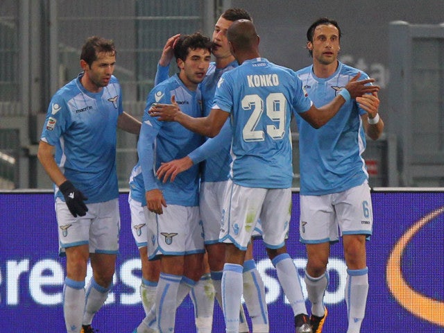 Alessandro Matri of Lazio celebrates with teammates after scoring in his side's 5-2 victory over Hellas Verona on February 11, 2016