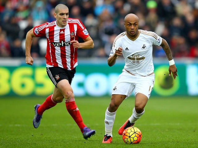 Andre Ayew of Swansea City and Oriol Romeu of Southampton compete for the ball on February 13, 2016