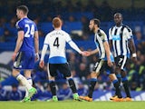 Andros Townsend takes Jack Colback's hand after grabbing a consolation during the Premier League game between Chelsea and Newcastle United on February 13, 2016