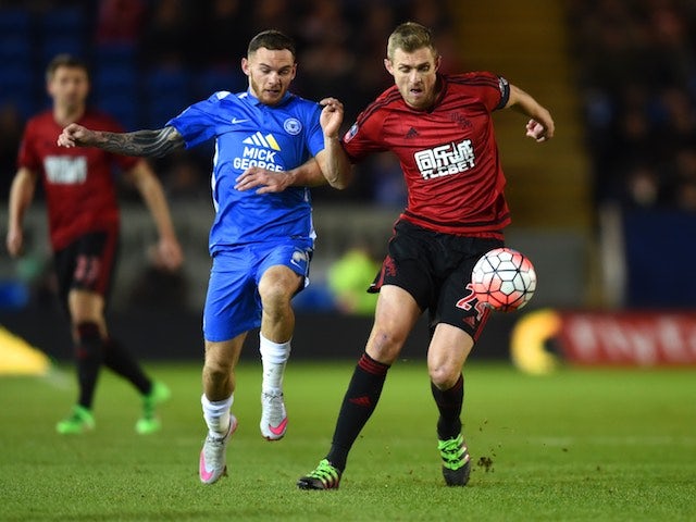 Darren Fletcher and Jon Taylor in action during the FA Cup replay between Peterborough United and West Bromwich Albion on February 10, 2016