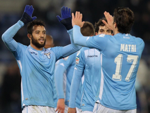 Lazio's Felipe Anderson and Alessandro Matri congratulate each other after a goal in their side's 5-2 victory over Verona on February 11, 2016