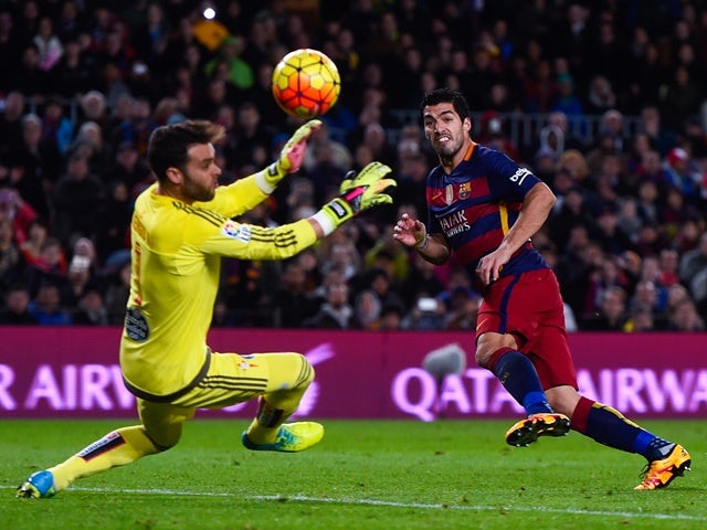 Luis Suarez scores Barcelona's second goal past Sergio Alvarez during the La Liga match against Celta Vigo at Camp Nou on February 14, 2016