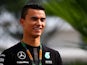 Pascal Wehrlein arrives in the paddock before final practice for the Formula 1 Grand Prix of Singapore at Marina Bay Street Circuit on September 19, 2015