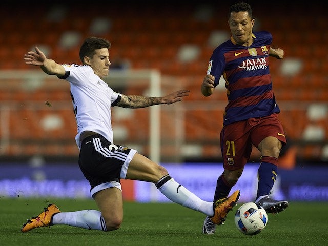 Santi Mina takes on Adriano during the Copa del Rey semi between Valencia and Barcelona on February 10, 2016