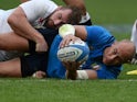 Sergio Parisse receives a cuddle from Jack Nowell during the Six Nations game between Italy and England on February 14, 2016