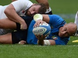 Sergio Parisse receives a cuddle from Jack Nowell during the Six Nations game between Italy and England on February 14, 2016