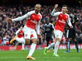 Theo Walcott celebrates scoring during the Premier League game between Arsenal and Leicester City on February 14, 2016
