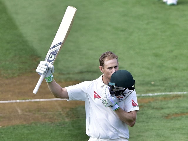 Adam Voges of Australia kisses a helmet in celebration of reaching 200 runs during day three of the first Test match against New Zealand on February 14, 2016
