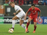 Alexander Esswein and Philippe Coutinho in action during the Europa League game between Augsburg and Liverpool on February 18, 2016