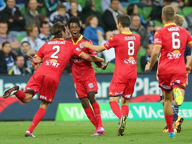 Bruce Kamau is congratulated by teammates after scoring during the A-League match between Melbourne Victory and Adelaide United on February 19, 2016