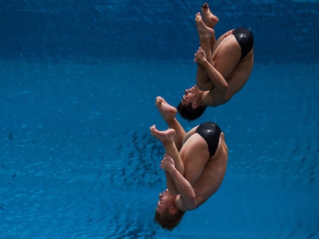 Jack Laugher and Chris Mears roll over during the Diving World Cup on February 19, 2016