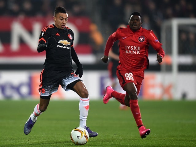 Jesse Lingard of Manchester United and Rilwan Hassan of FC Midtjylland compete for the ball on February 18, 2016