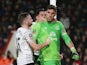 Joel Robles of Everton is congratulated by teammates Tom Cleverley and Ramiro Funes Mori after stopping a penalty kick during the FA Cup fifth-round match against Bournemouth on February 20, 2016 