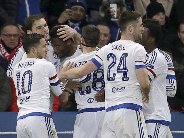 John Obi Mikel is congratulated by teammates after scoring during the Champions League encounter between Paris Saint-Germain and Chelsea on February 16, 2016