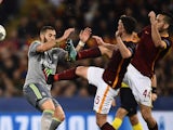 Miralem Pjanic and Konstas Manolas gang up on Karim Benzema during the Champions League match between AS Roma and Real Madrid on February 17, 2016