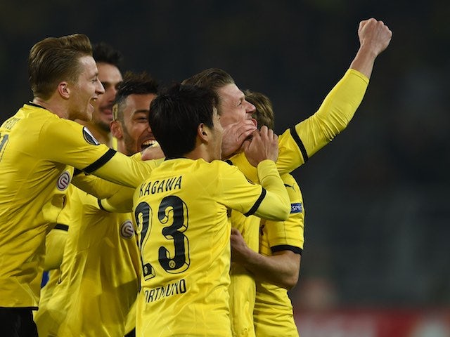 Lukasz Piszczek celebrates with teammates during the Europa League game between Borussia Dortmund and Porto on February 18, 2016
